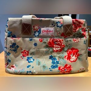 Cath Kidston overnight bag, floral pattern on light gray background.